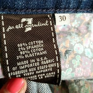 Cut off jean shorts with peekaboo floral pockets